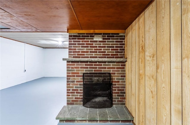 details featuring wood walls and a fireplace