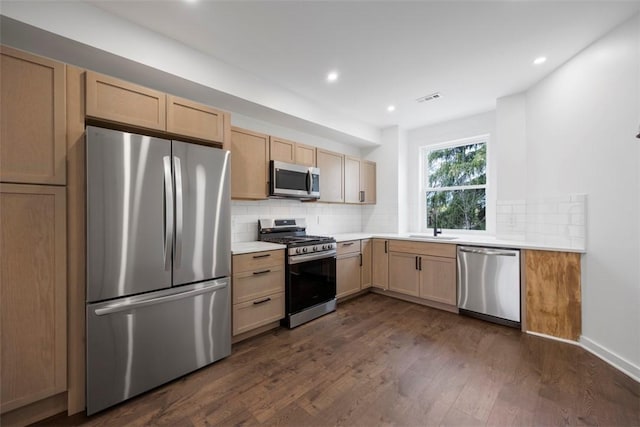 1523 Westmoreland Ave, Lincoln-Larimer, PA 15206 - kitchen featuring stainless steel appliances, dark wood-type flooring, visible vents, and a sink