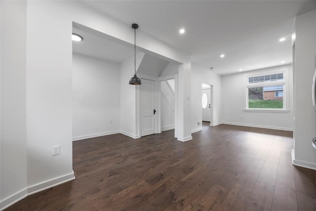 1523 Westmoreland Ave, Lincoln-Larimer, PA 15206 - unfurnished living room featuring dark wood-style flooring, baseboards, recessed lighting, and stairway