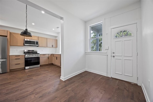 1523 Westmoreland Ave, Lincoln-Larimer, PA 15206 - kitchen featuring tasteful backsplash, baseboards, light countertops, appliances with stainless steel finishes, and dark wood-type flooring