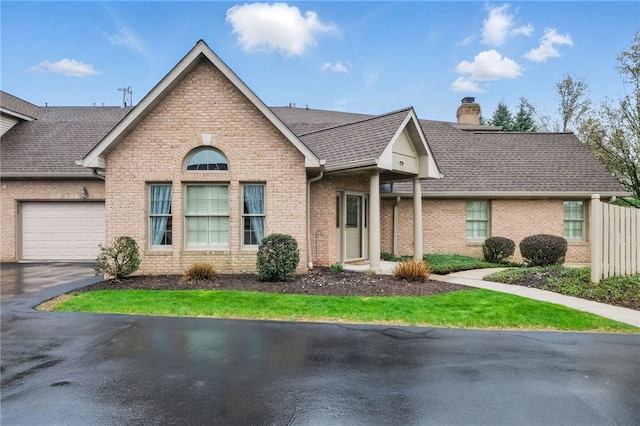 325 Village Green Dr, Peters Twp, PA 15317 - ranch-style home featuring roof with shingles, a chimney, a garage, and brick siding