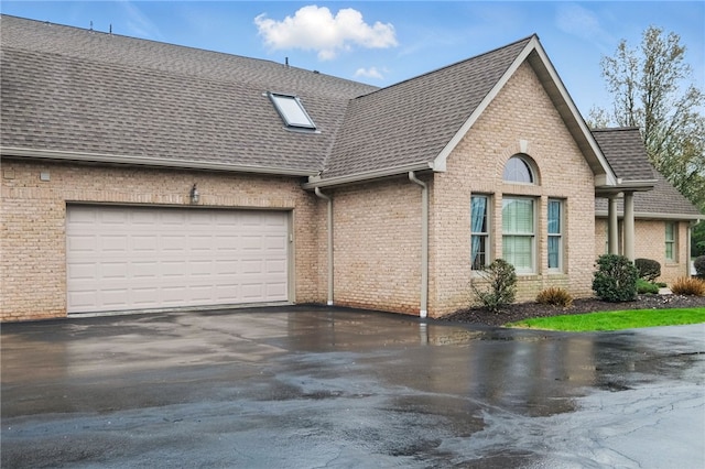 325 Village Green Dr, Peters Twp, PA 15317 - view of front facade featuring a shingled roof, driveway, a garage, and brick siding