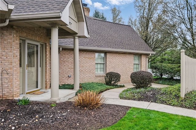 325 Village Green Dr, Peters Twp, PA 15317 - view of home's exterior featuring brick siding, a shingled roof, and a chimney
