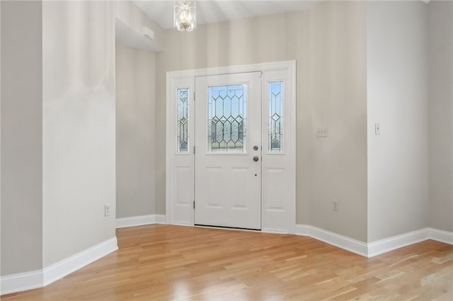 325 Village Green Dr, Peters Twp, PA 15317 - foyer featuring baseboards, light wood finished floors, and a notable chandelier