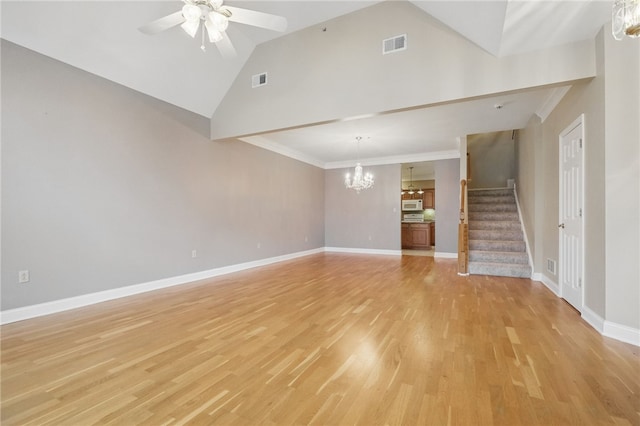 325 Village Green Dr, Peters Twp, PA 15317 - unfurnished living room featuring light wood-type flooring, ceiling fan with notable chandelier, visible vents, and stairway