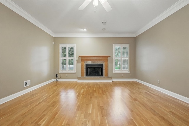 325 Village Green Dr, Peters Twp, PA 15317 - unfurnished living room featuring plenty of natural light, visible vents, crown molding, and a premium fireplace