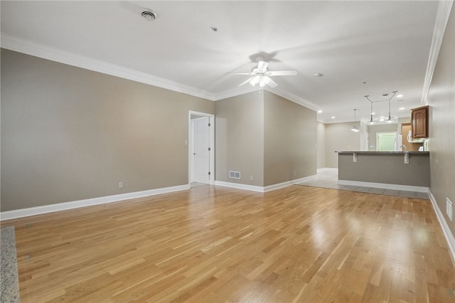 325 Village Green Dr, Peters Twp, PA 15317 - unfurnished living room with crown molding, light wood finished floors, baseboards, and a ceiling fan
