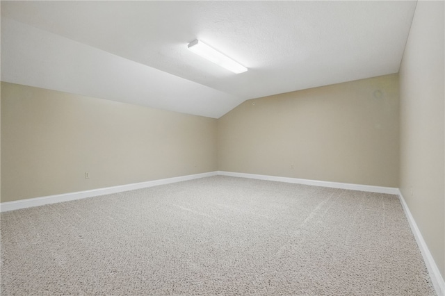325 Village Green Dr, Peters Twp, PA 15317 - additional living space with baseboards, carpet flooring, and lofted ceiling