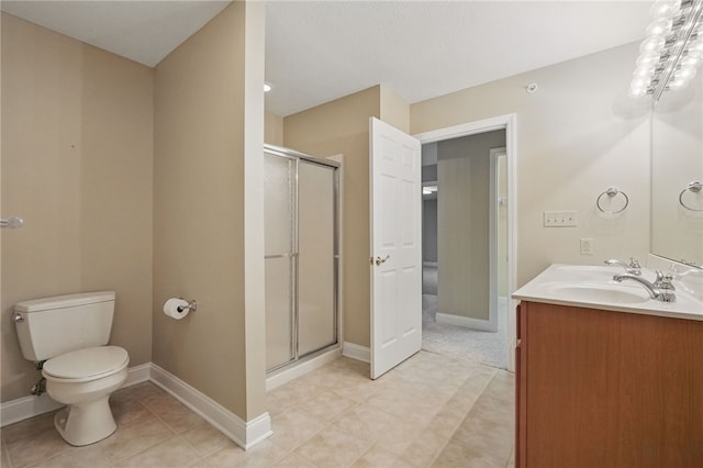 325 Village Green Dr, Peters Twp, PA 15317 - bathroom featuring toilet, baseboards, a stall shower, and vanity