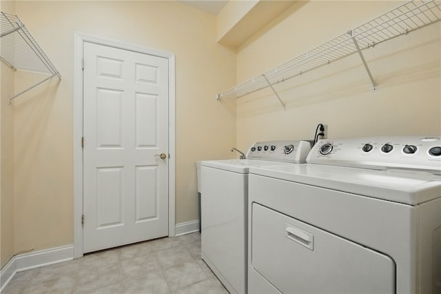325 Village Green Dr, Peters Twp, PA 15317 - laundry room featuring separate washer and dryer, laundry area, and baseboards
