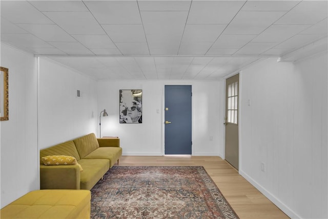 living area featuring light wood-type flooring and baseboards