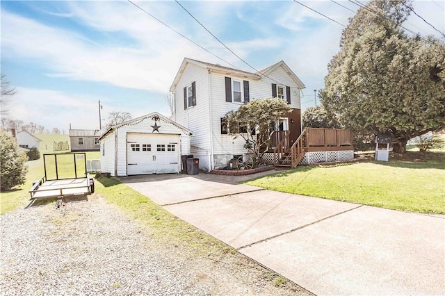 448 E Main St, Dayton, PA 16222 - traditional home with concrete driveway, an outdoor structure, a front yard, a wooden deck, and a garage