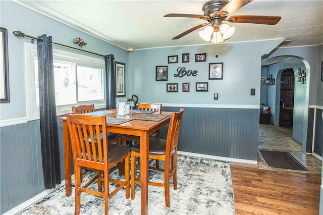 448 E Main St, Dayton, PA 16222 - dining room with arched walkways, wood finished floors, ceiling fan, and a wainscoted wall
