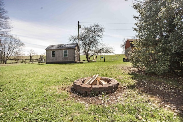 448 E Main St, Dayton, PA 16222 - view of yard with an outbuilding, fence, and a fire pit