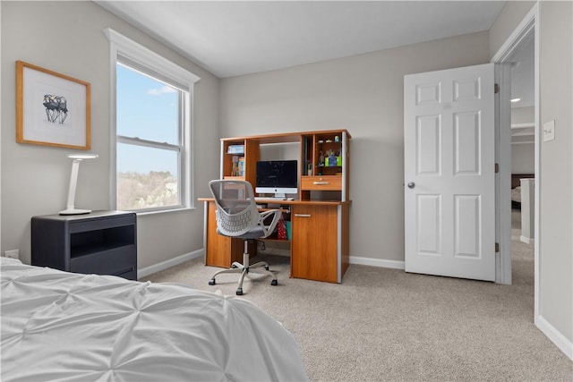 carpeted bedroom featuring baseboards