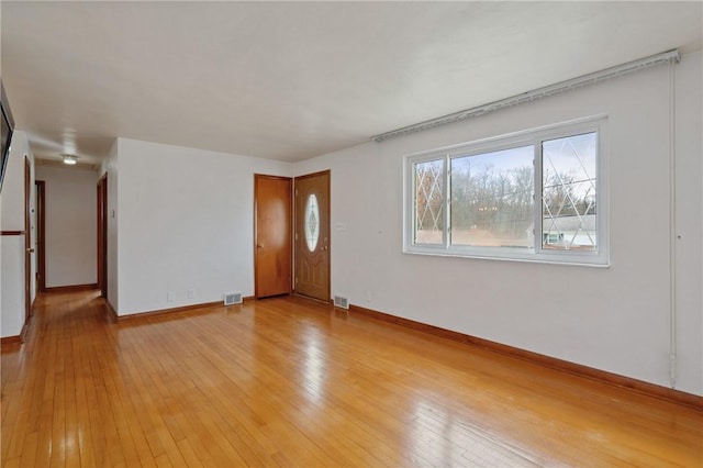 126 Peony Ave, Ross Twp, PA 15229 - unfurnished living room with visible vents, baseboards, and light wood-style floors