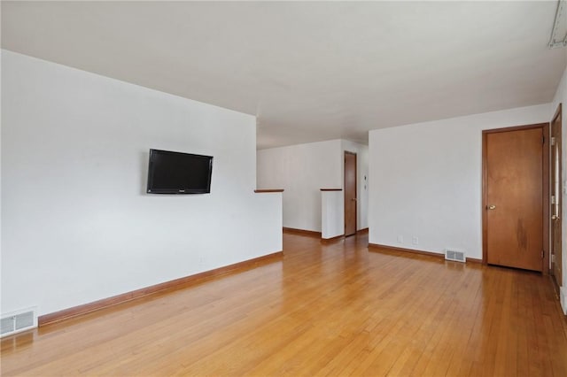 126 Peony Ave, Ross Twp, PA 15229 - unfurnished living room featuring baseboards, visible vents, and light wood-style flooring