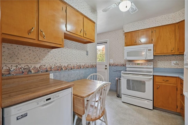 126 Peony Ave, Ross Twp, PA 15229 - kitchen featuring ceiling fan, white appliances, brown cabinetry, light countertops, and wallpapered walls