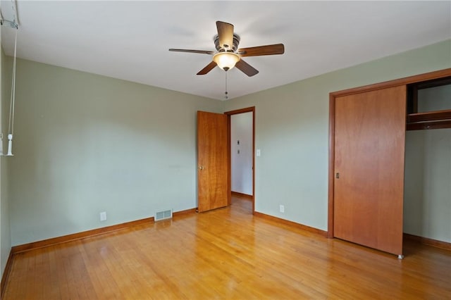 126 Peony Ave, Ross Twp, PA 15229 - unfurnished bedroom featuring visible vents, baseboards, light wood finished floors, and a closet