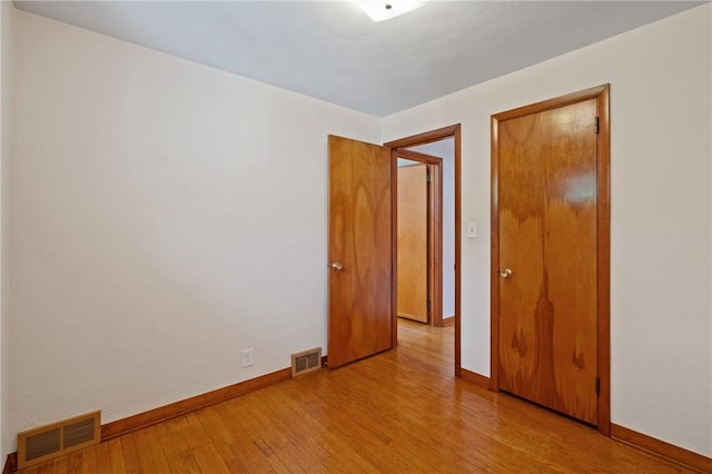 126 Peony Ave, Ross Twp, PA 15229 - spare room with visible vents, light wood-style flooring, and baseboards
