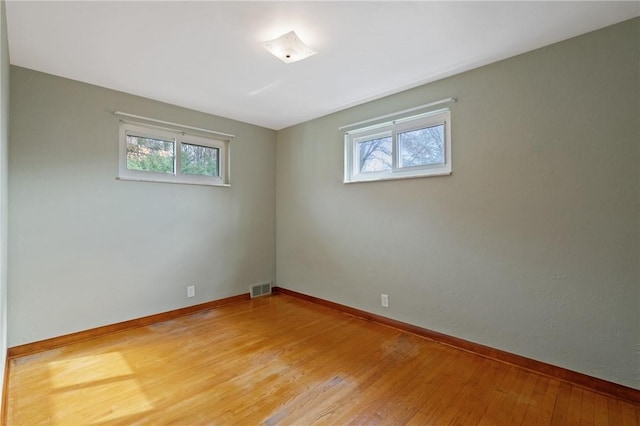 126 Peony Ave, Ross Twp, PA 15229 - unfurnished room with visible vents, baseboards, light wood-style flooring, and plenty of natural light