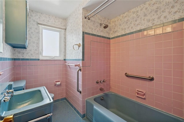 126 Peony Ave, Ross Twp, PA 15229 - full bathroom with wallpapered walls, toilet, shower / bath combination, tile walls, and wainscoting