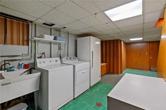 126 Peony Ave, Ross Twp, PA 15229 - laundry area featuring tile patterned floors, washer and dryer, laundry area, and a sink