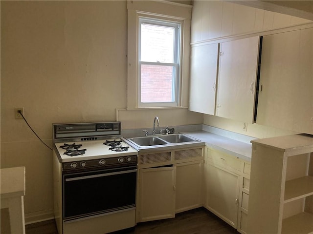 129 Park Ave, New Castle/2Nd, PA 16101 - kitchen with a sink, light countertops, white cabinetry, and white gas range oven