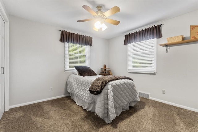 bedroom with visible vents, carpet flooring, and baseboards
