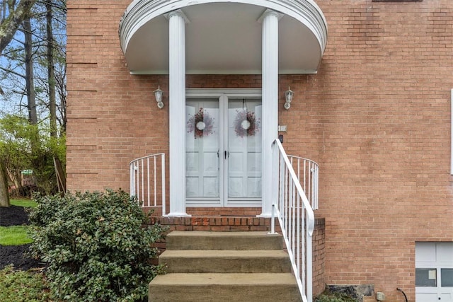 entrance to property with brick siding