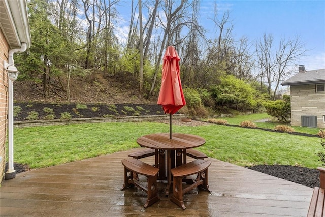 exterior space with outdoor dining area and a yard