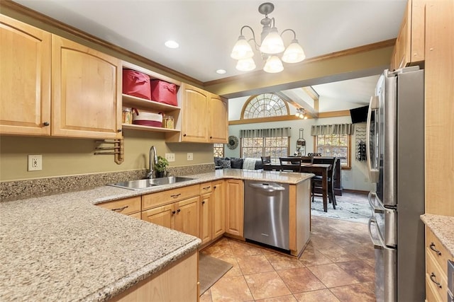 kitchen with a sink, a peninsula, an inviting chandelier, light brown cabinets, and stainless steel appliances