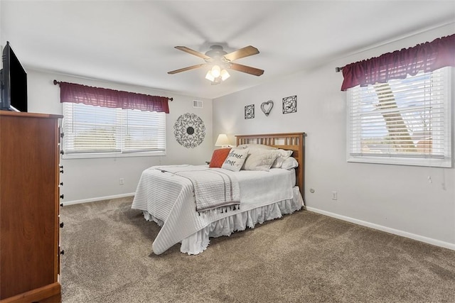 bedroom featuring a ceiling fan, baseboards, visible vents, and carpet