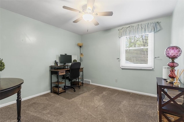 carpeted office featuring ceiling fan, visible vents, and baseboards
