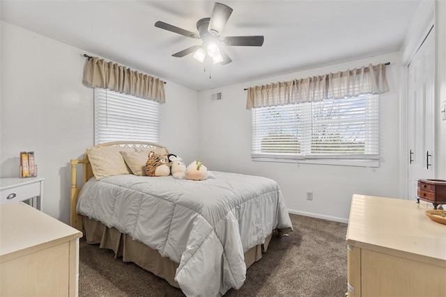 bedroom featuring visible vents, carpet flooring, baseboards, and ceiling fan