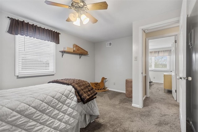 bedroom featuring carpet floors, a ceiling fan, baseboards, and visible vents