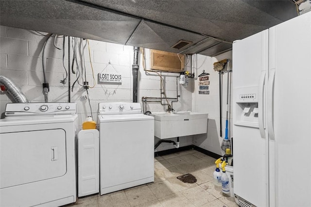 laundry area featuring visible vents and independent washer and dryer