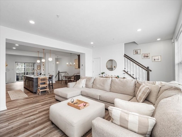 308 Thurgood Dr, Marshall, PA 15086 - living area with a chandelier, recessed lighting, light wood-type flooring, and stairs