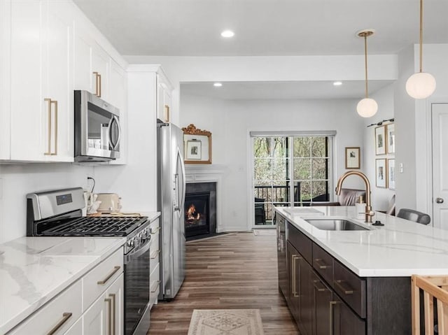 308 Thurgood Dr, Marshall, PA 15086 - kitchen with white cabinets, a sink, dark wood-style flooring, a kitchen island with sink, and stainless steel appliances