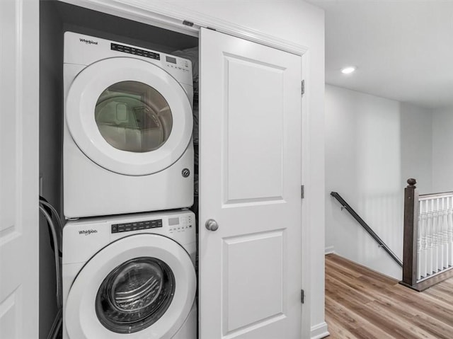 308 Thurgood Dr, Marshall, PA 15086 - clothes washing area featuring recessed lighting, stacked washing maching and dryer, laundry area, and wood finished floors