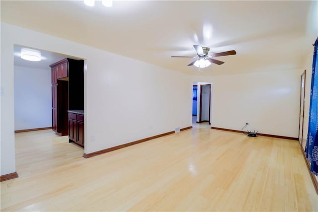 1282 Cook School Rd, Bridgeville, PA 15017 - empty room featuring light wood-type flooring, baseboards, and ceiling fan