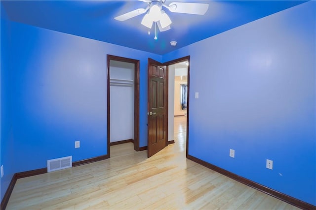 1282 Cook School Rd, Bridgeville, PA 15017 - unfurnished bedroom featuring light wood-type flooring, a closet, a ceiling fan, visible vents, and baseboards