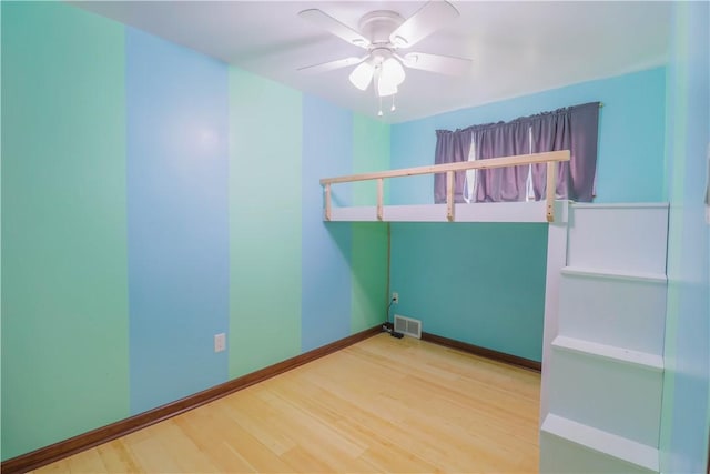 1282 Cook School Rd, Bridgeville, PA 15017 - unfurnished room featuring visible vents, ceiling fan, baseboards, and wood finished floors