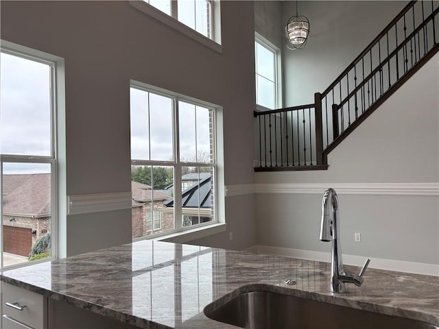 kitchen featuring a sink and plenty of natural light
