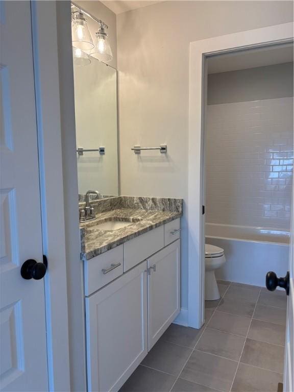 full bath with toilet, tile patterned floors, and vanity