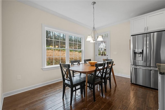 dining area with ornamental molding, baseboards, and dark wood-type flooring