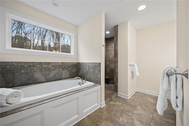 full bathroom featuring baseboards, recessed lighting, a tile shower, and a bath