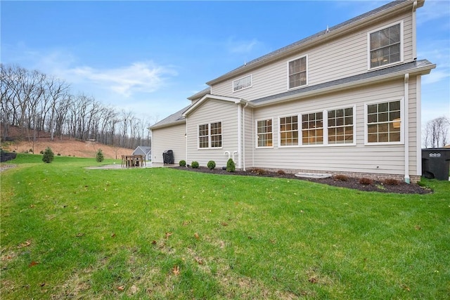 rear view of house with a lawn