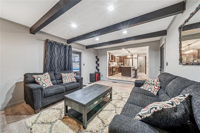 living room with beam ceiling, light wood-style flooring, recessed lighting, and baseboards