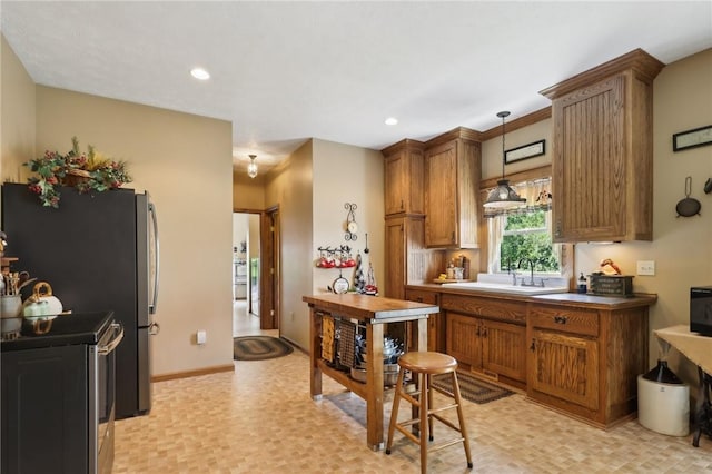 56 Hicks Rd, Donegal Twp Wsh, PA 15376 - kitchen featuring stainless steel range with electric cooktop, brown cabinetry, decorative light fixtures, and recessed lighting